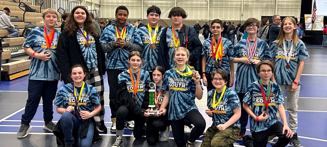 Science Olympiad Team with Medals and Trophy