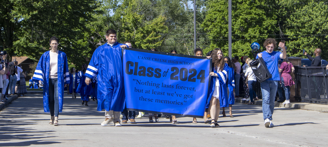 L'Anse Creuse High School Class of 2024 during their final walk through the high school.